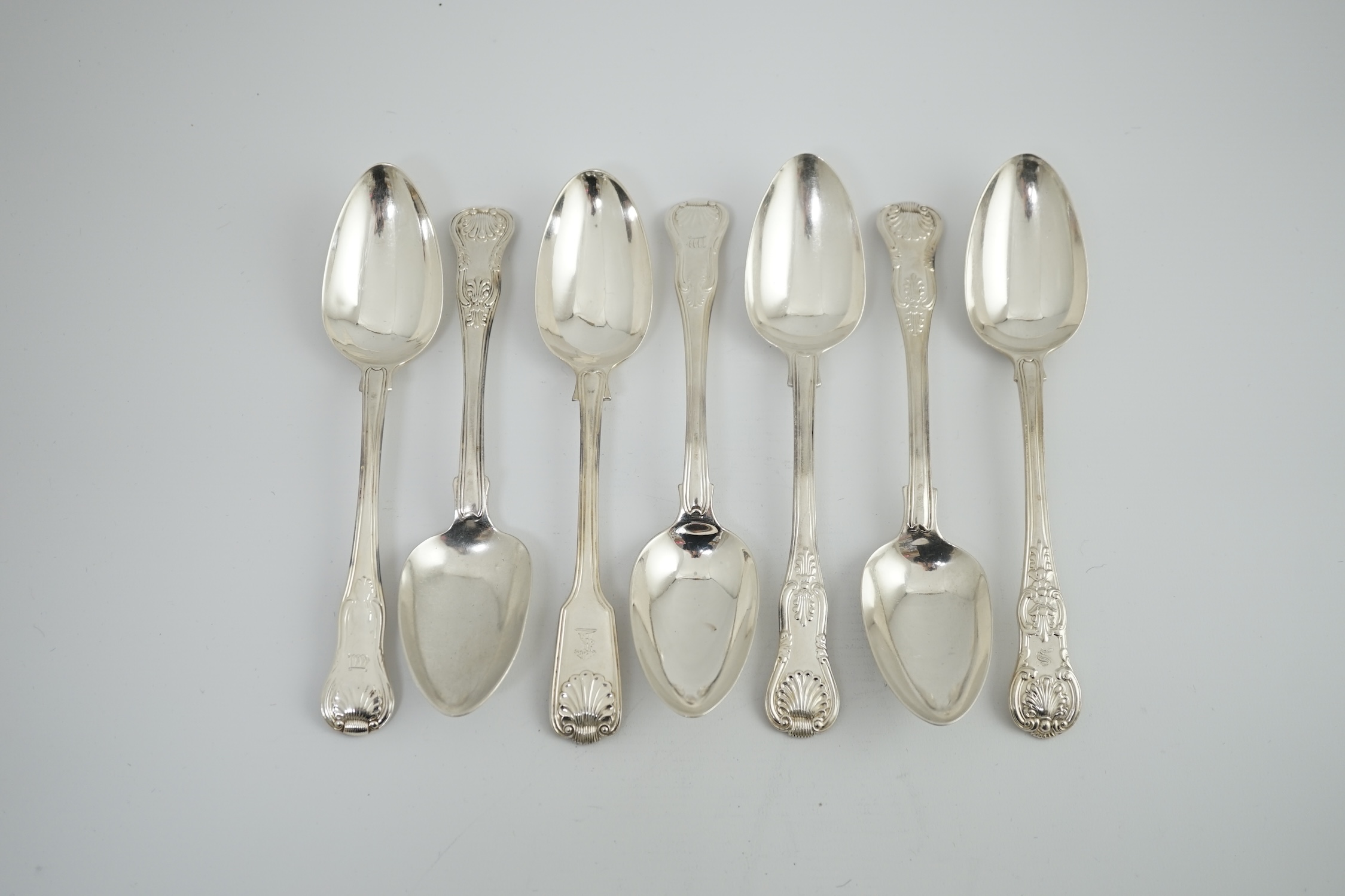 A harlequin set of six Georgian and Victorian silver Kings pattern table spoons, various dates and makers